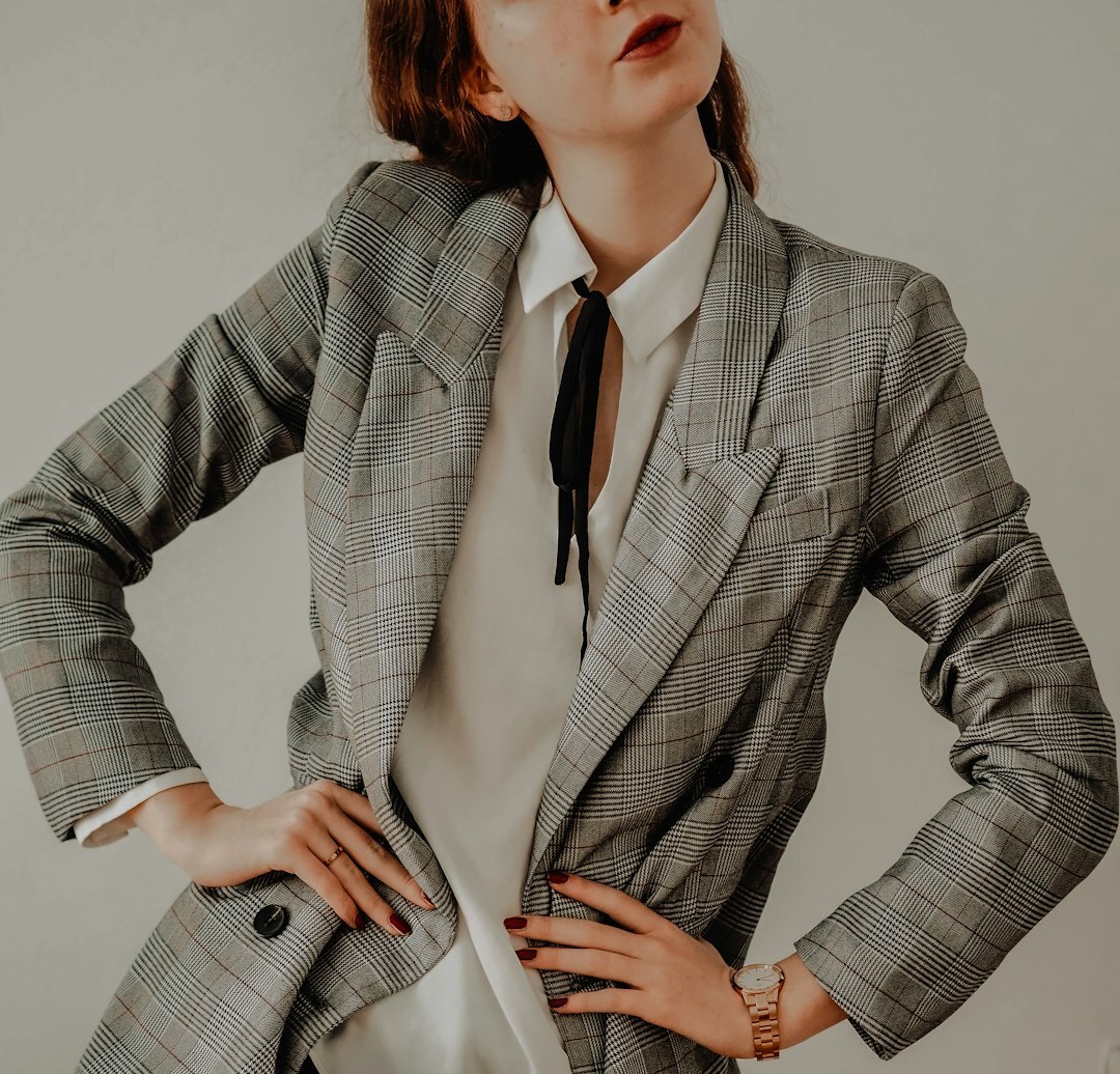 Portrait of the boutique's founder in elegant business attire