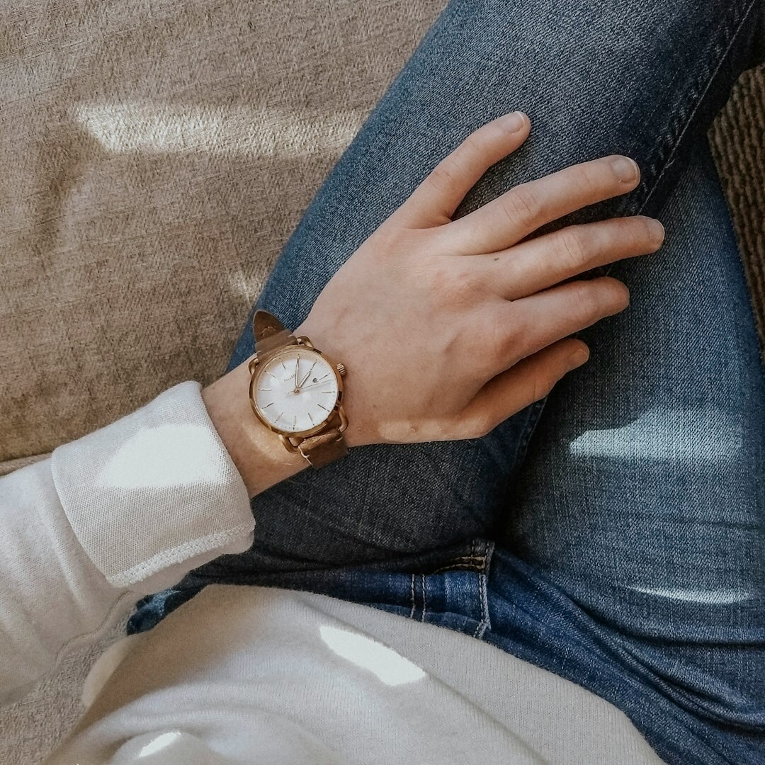 Elegant hands of a Uruguayan woman adjusting a luxury wristwatch