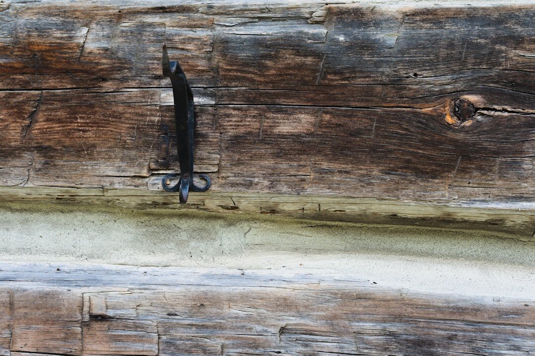 Close-up of handcrafted acetate eyewear frames on a wooden surface